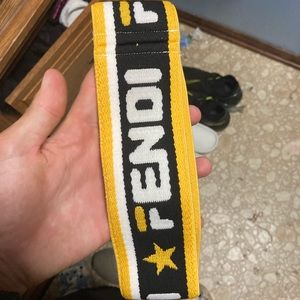 Authentic Fendi unisex sports headband with authenticity tags.